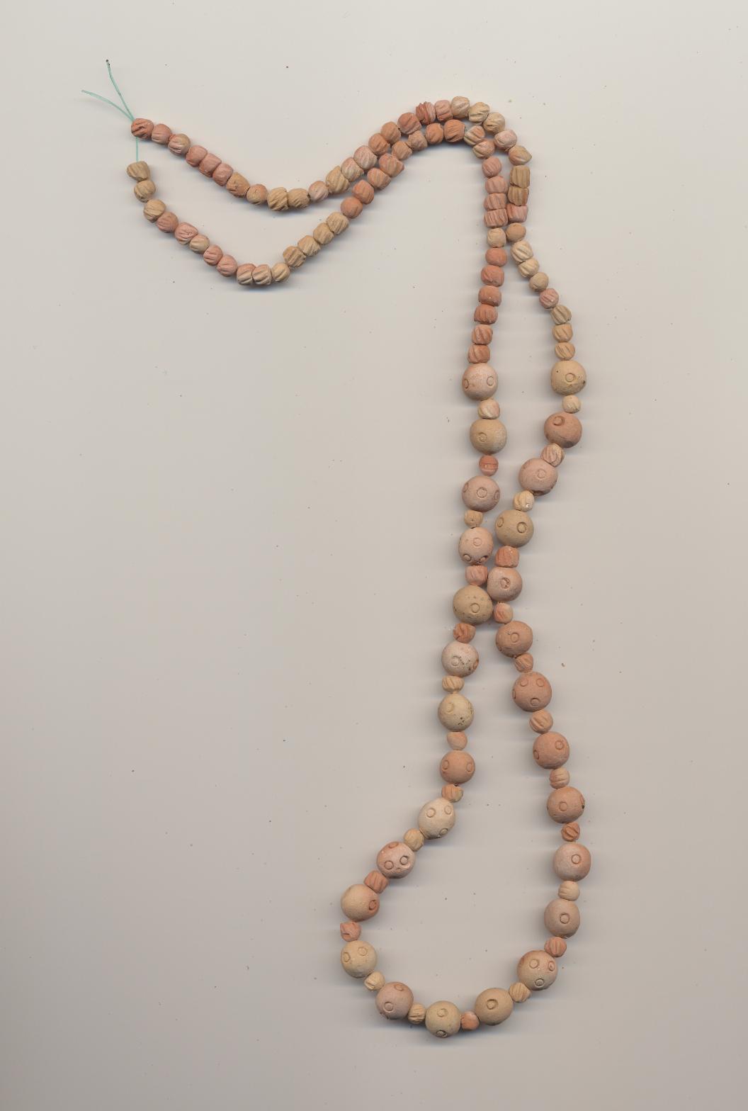 Necklace of hand made sunbaked clay beads with eye motif, Mexico, 1990's, length 28'' 70cm.